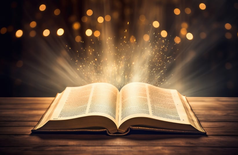 an open bible with light